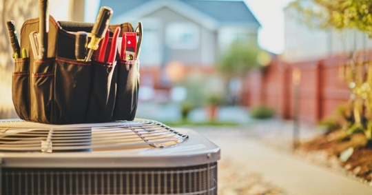 Toolbox on top of an HVAC outdoor unit
