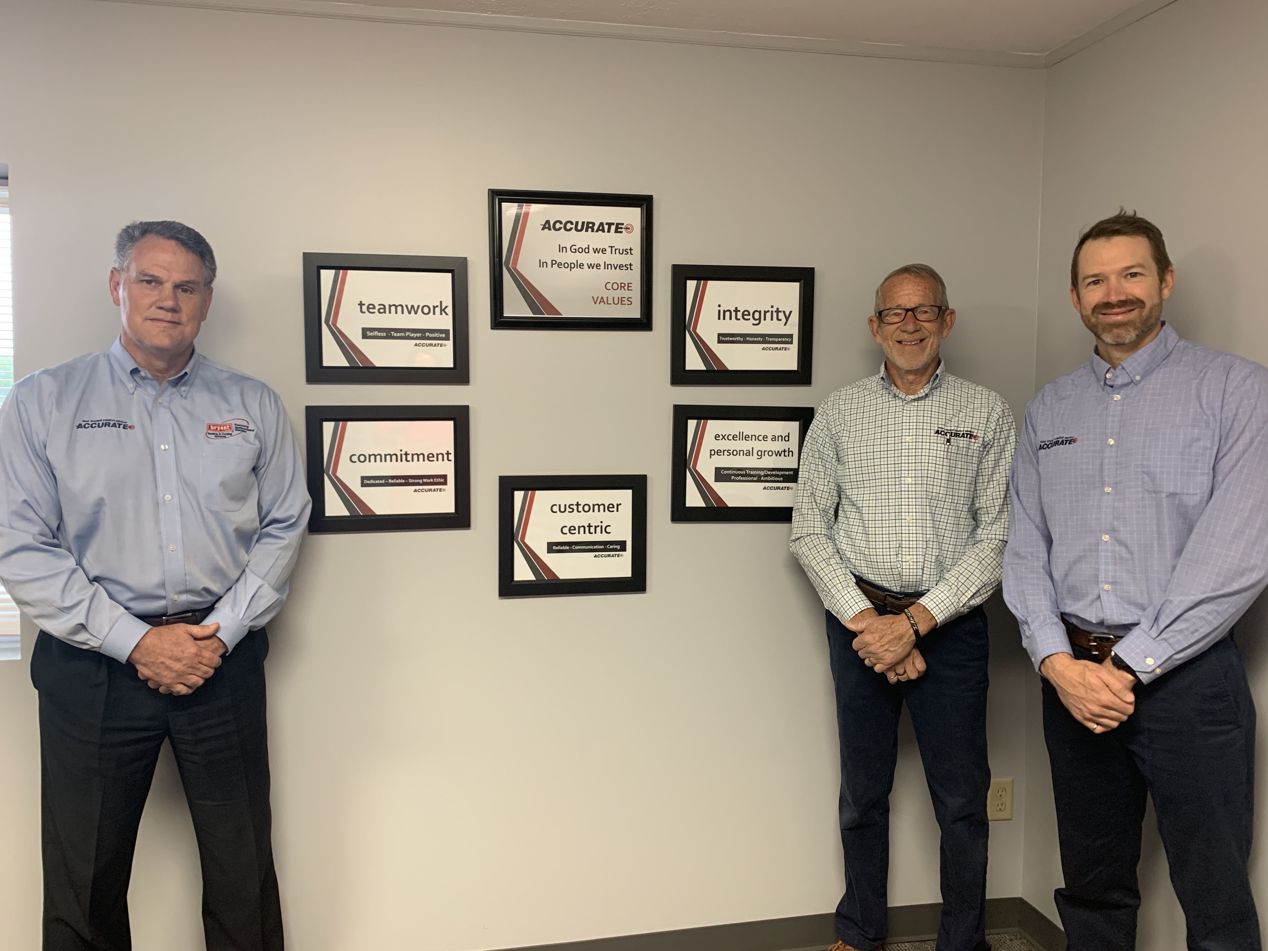 Tom, Brian, Michael standing by our values framed